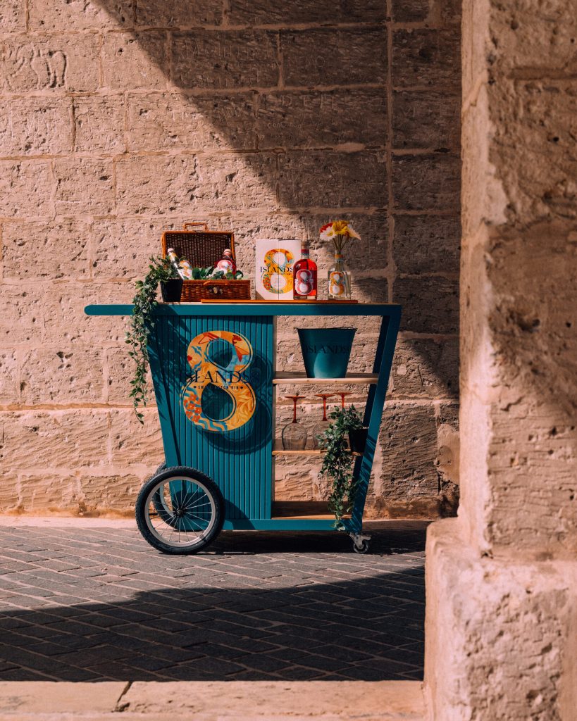 The Islands8 bar cart set up in a sunlit Maltese alley