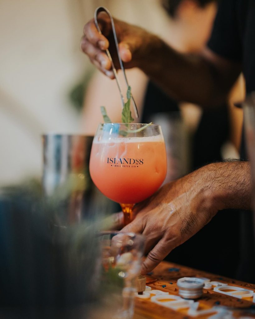 A bartender preparing a frozen Islands8 cocktail